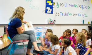 Woman reading to a class of young children