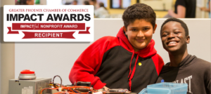 Two boys smiling with Impact Awards logo