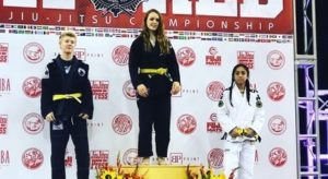 Kylie standing for first place in Jiu-Jitsu competition