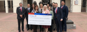 Group of JA and Bank of America employees holding $200,000 check