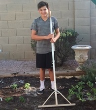 Rocco Gump raking a garden