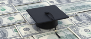 Graduation cap sitting on cash
